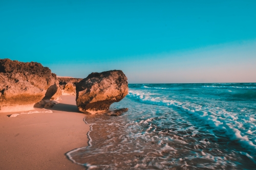 Brown rock formation on sea shore during daytime photo – Free Nature Image